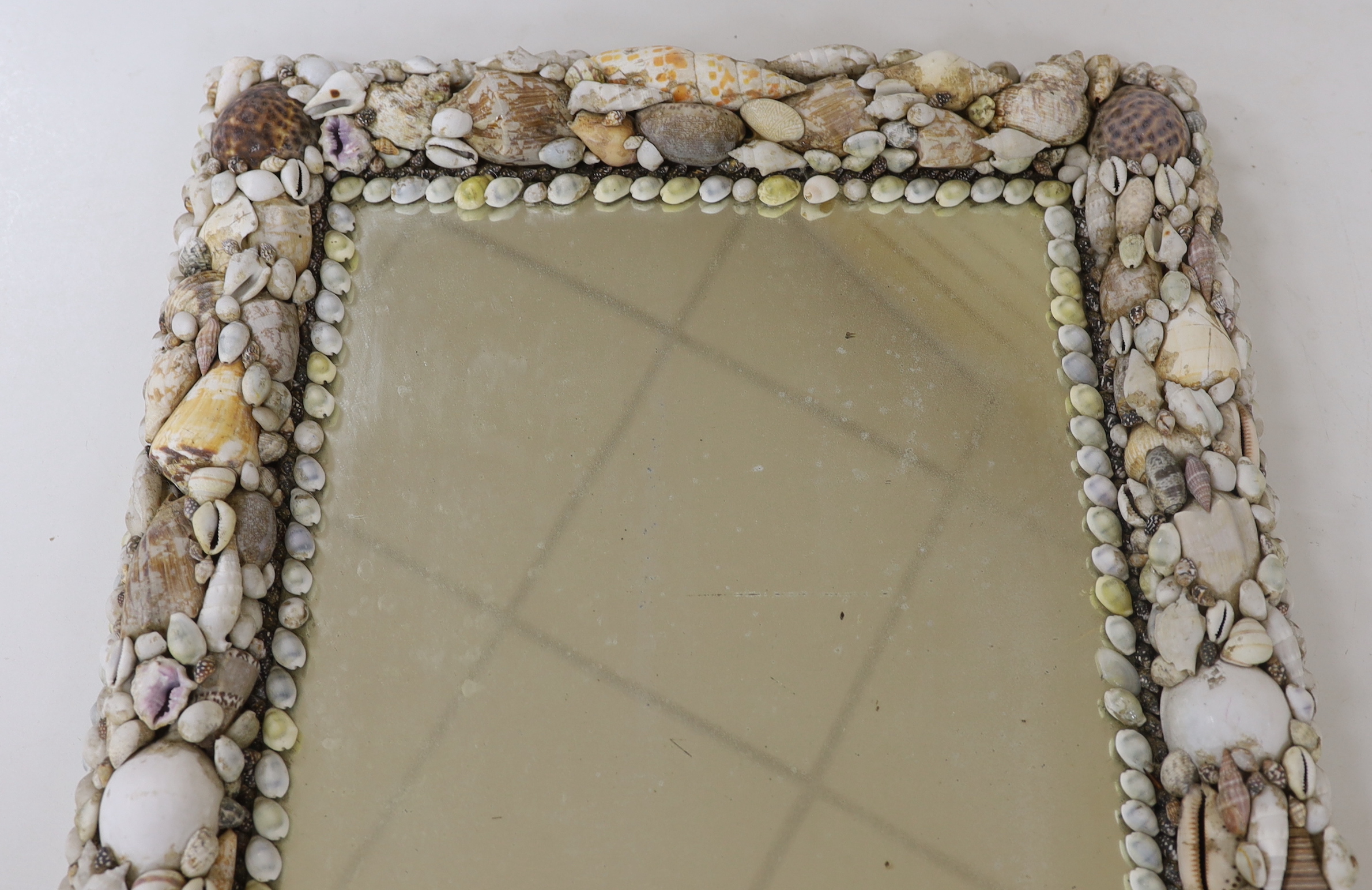 A shellwork framed wall mirror, 63x50cm